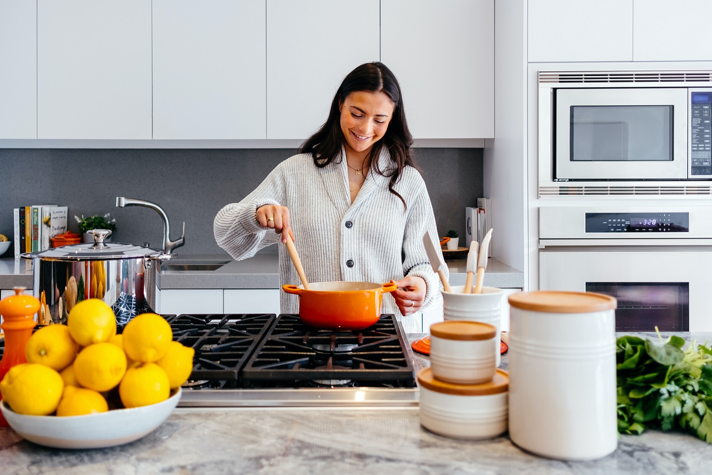 woman smiling and creating a family-centered kitchen