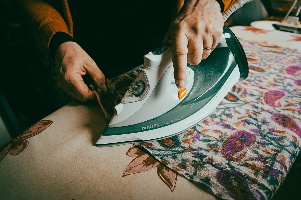 elderly woman ironing