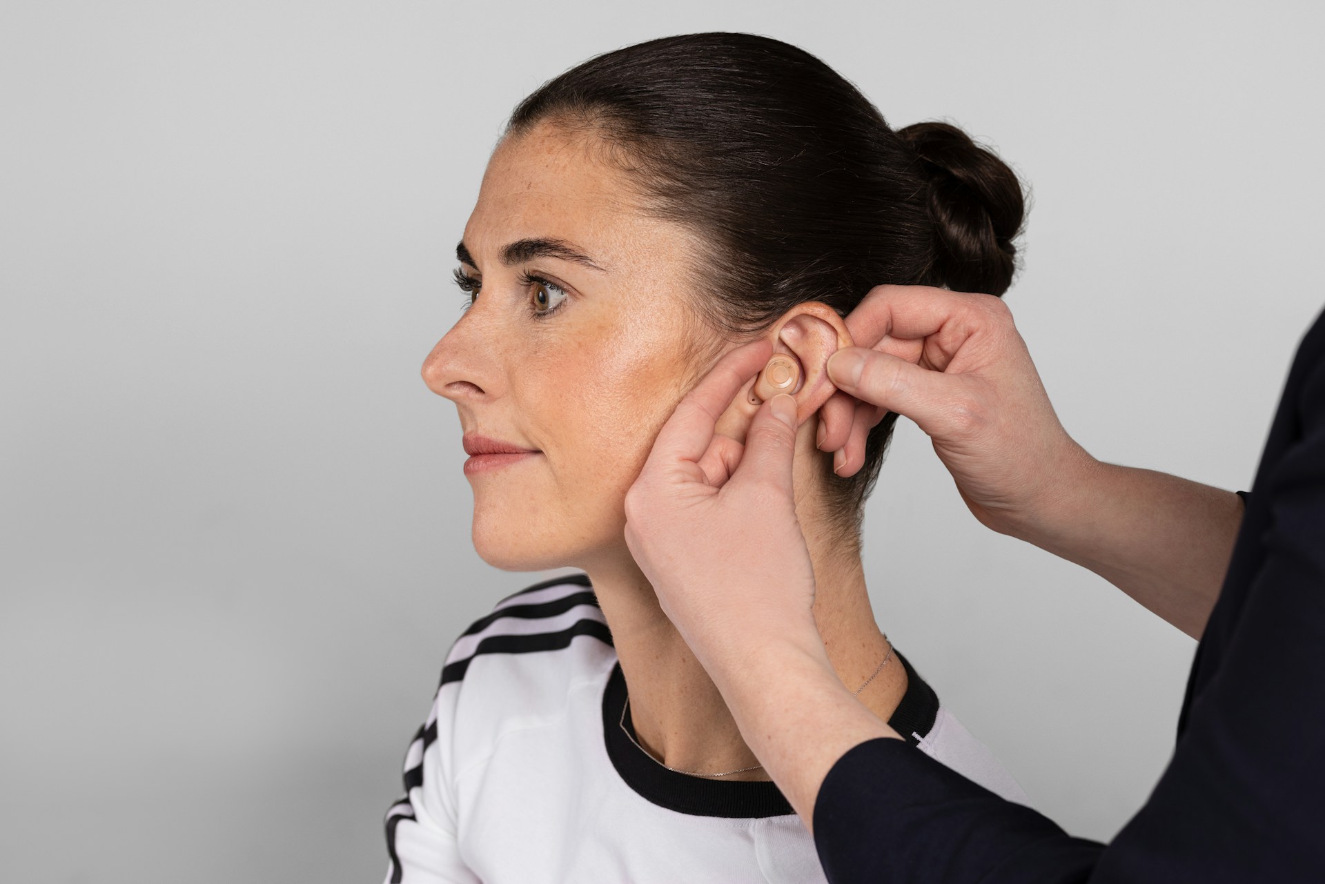 woman getting hearing aids